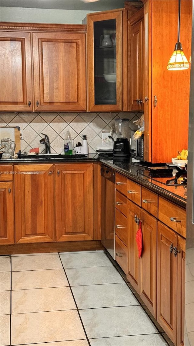 3800 S Ocean Dr Unit 416, Hollywood, FL 33019 - kitchen featuring brown cabinetry, tasteful backsplash, dishwasher, and glass insert cabinets
