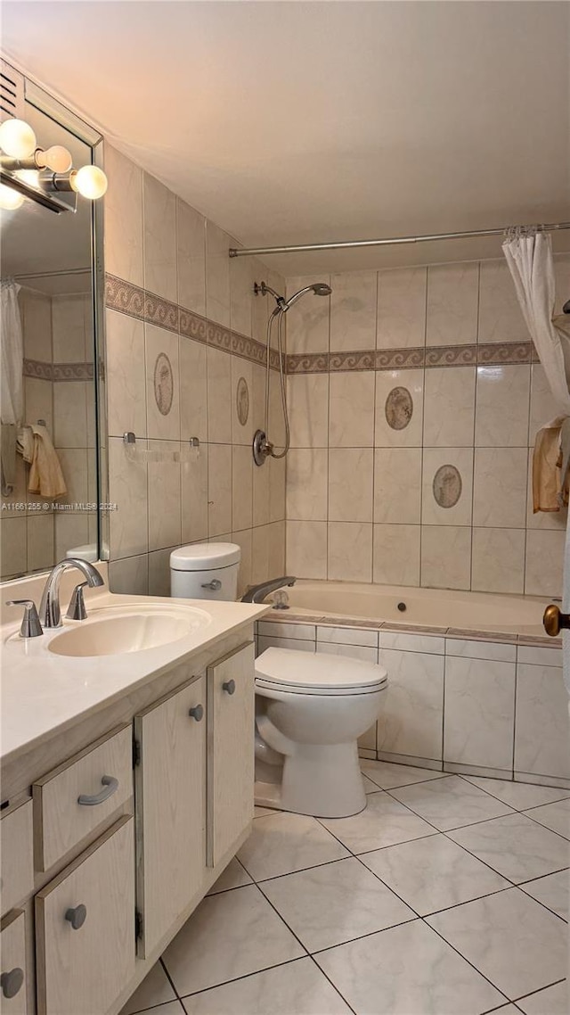 full bathroom with shower / bath combo with shower curtain, tile walls, vanity, and toilet