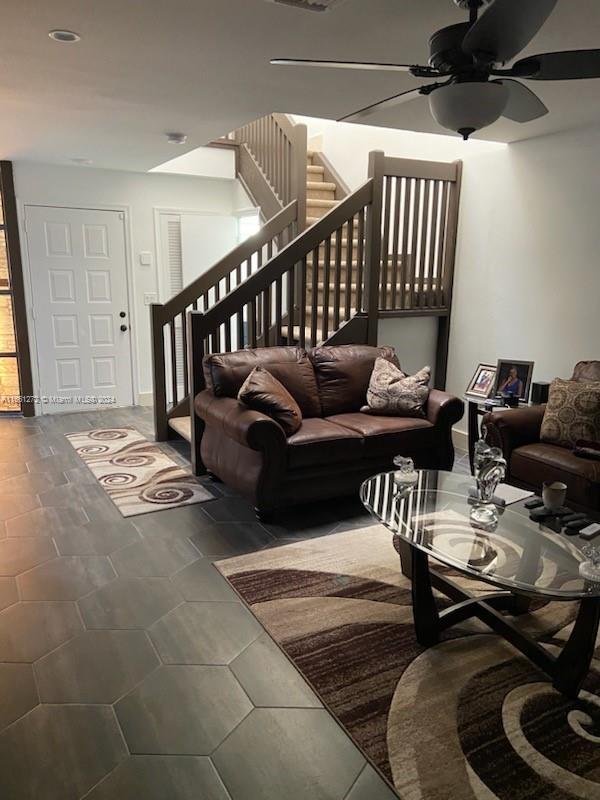 living room with ceiling fan