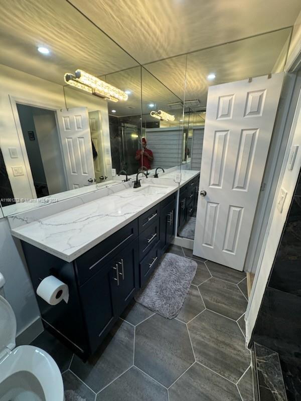 bathroom with vanity and toilet