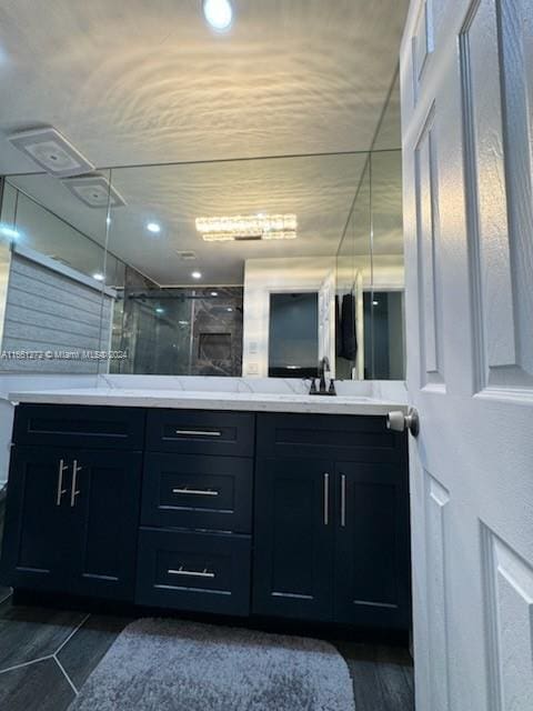 bathroom with vanity and an enclosed shower