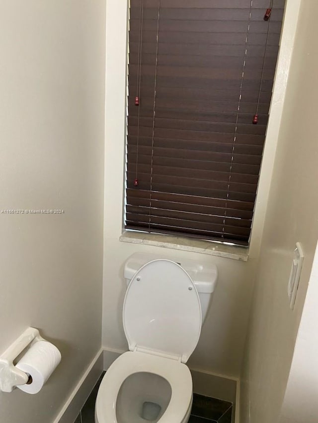 bathroom featuring toilet