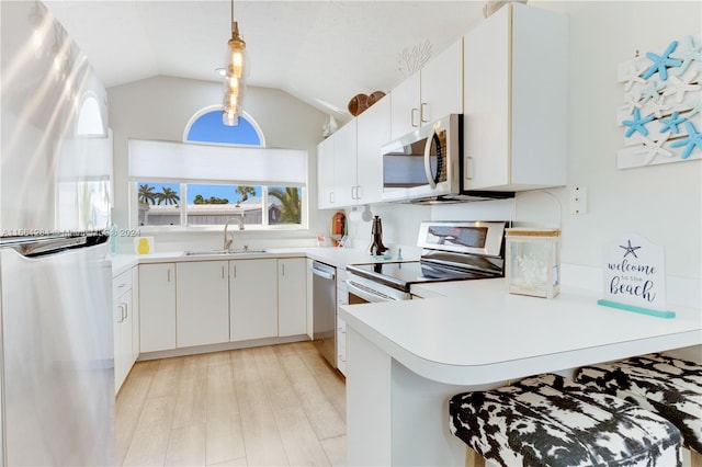 kitchen featuring light hardwood / wood-style flooring, stainless steel appliances, sink, and white cabinetry