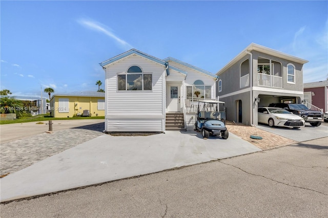 view of front of home featuring a carport