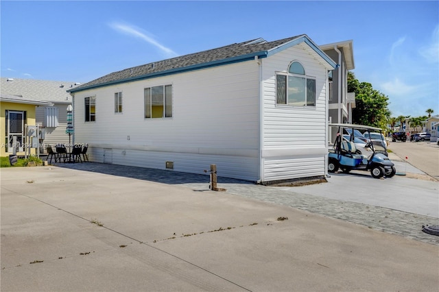 view of side of home featuring a patio area