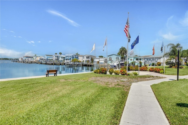 exterior space featuring a water view and a yard