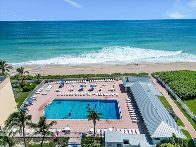 bird's eye view with a water view and a view of the beach