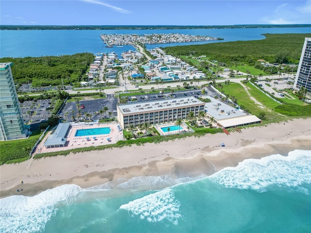 drone / aerial view with a view of the beach and a water view