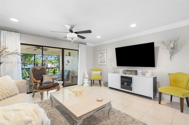 living room featuring ceiling fan, light tile patterned floors, and ornamental molding