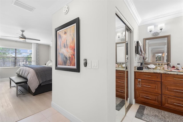 bathroom with ceiling fan, tile patterned floors, decorative backsplash, vanity, and ornamental molding