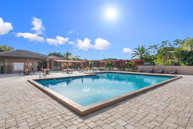 view of swimming pool featuring a patio