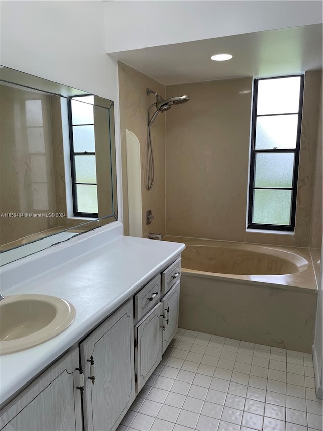 bathroom featuring vanity, shower with separate bathtub, and tile patterned flooring