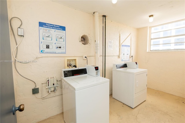 clothes washing area featuring washing machine and clothes dryer