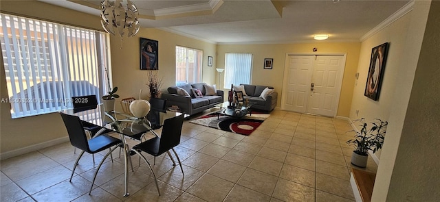 dining room with tile patterned flooring, crown molding, and baseboards