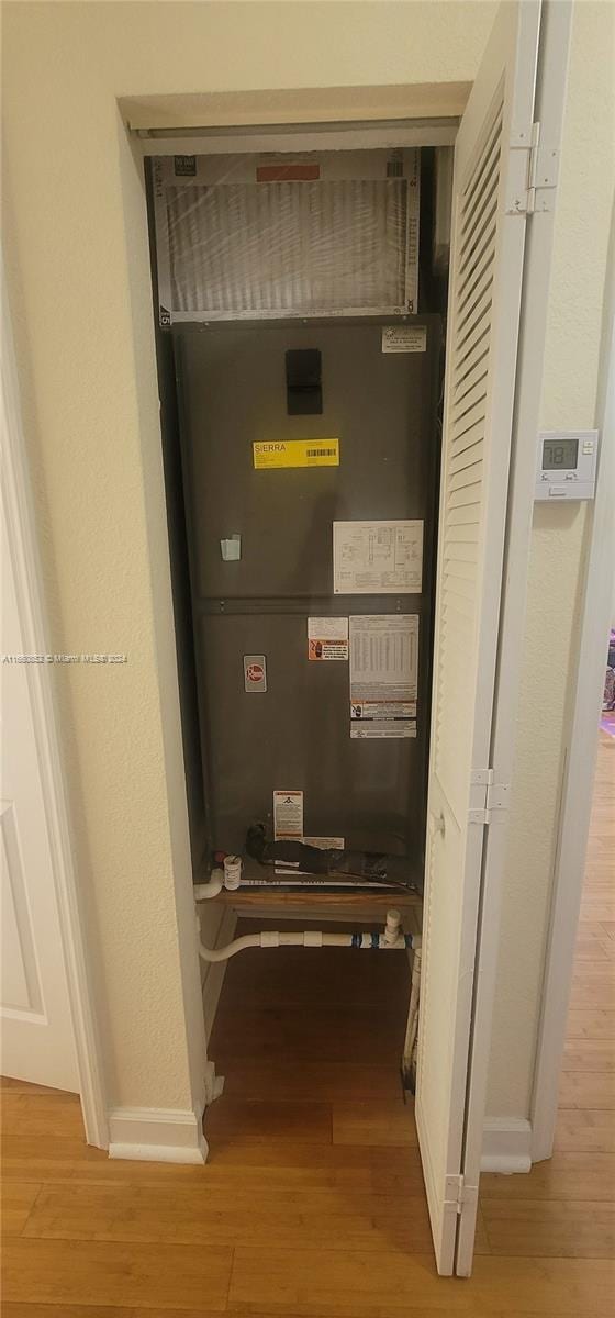 utility room with heating unit