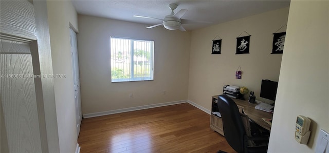 office with ceiling fan, baseboards, and wood finished floors