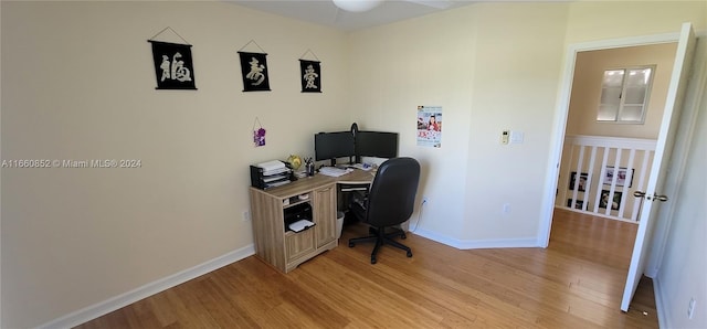 office featuring light wood-type flooring and ceiling fan