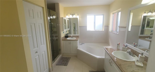 bathroom with independent shower and bath, vanity, and tile patterned floors