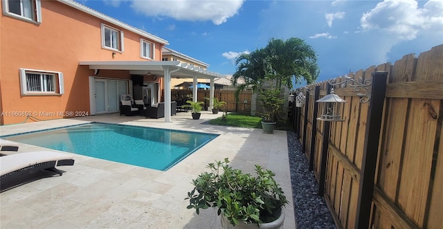 view of swimming pool featuring a pergola and a patio area