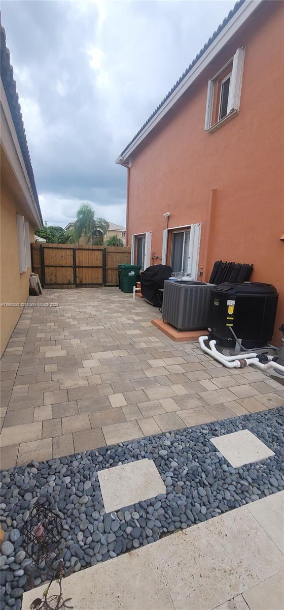 view of patio featuring fence