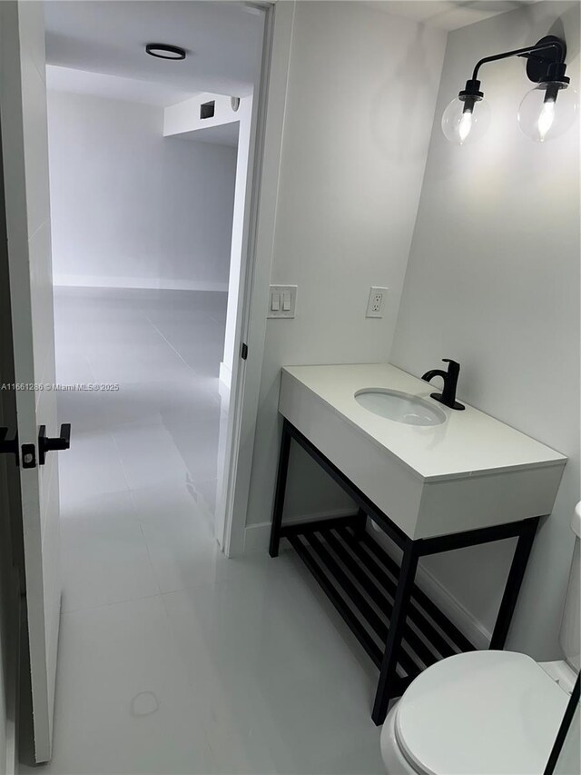 bathroom with toilet and vanity