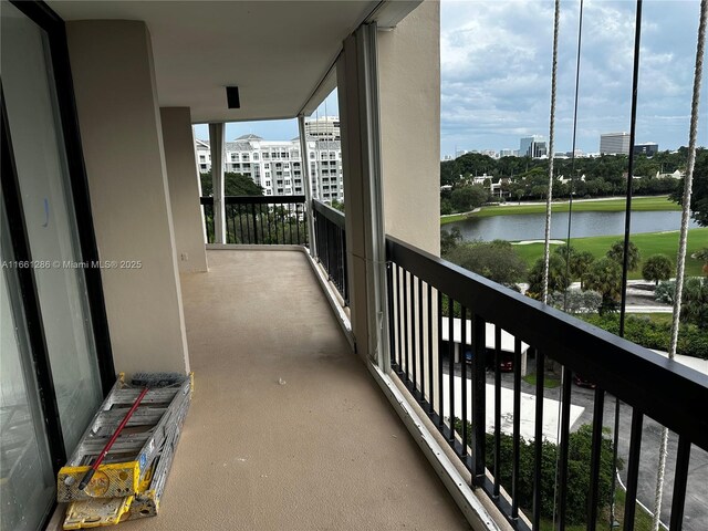 balcony featuring a water view