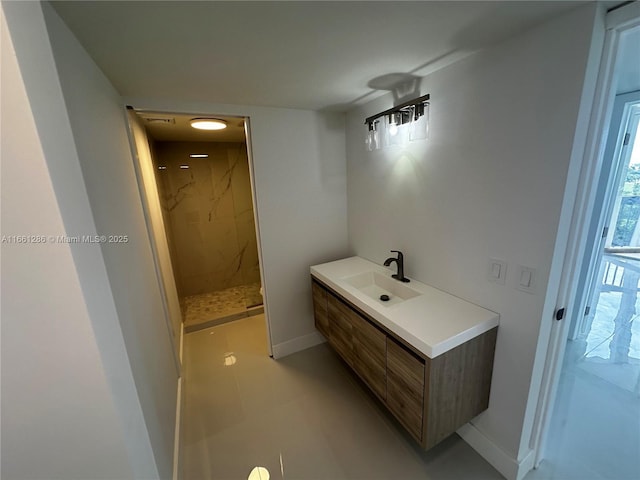 bathroom with walk in shower and vanity