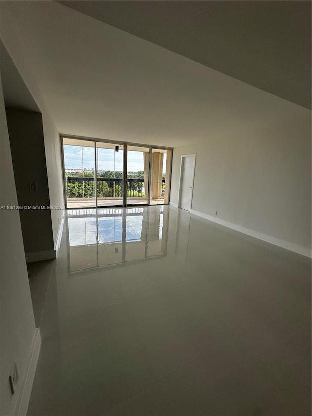 spare room featuring floor to ceiling windows