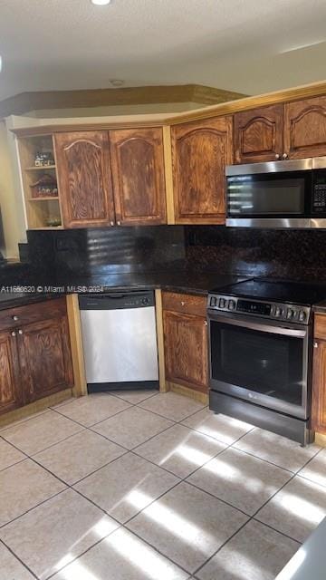 kitchen featuring appliances with stainless steel finishes and light tile patterned floors