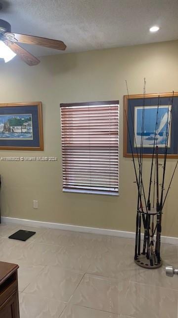 tiled spare room with recessed lighting, ceiling fan, and baseboards
