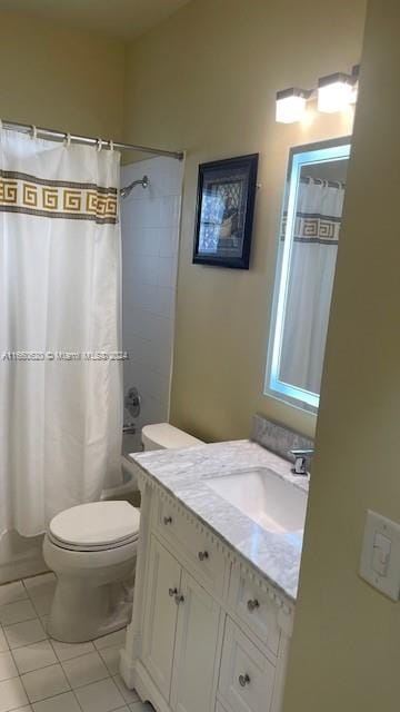 bathroom featuring tile patterned floors, vanity, and toilet