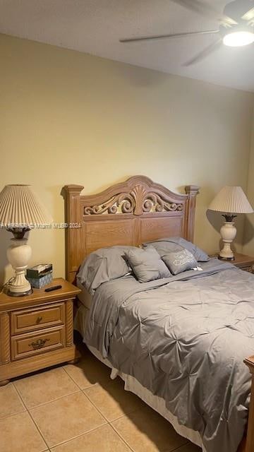 bedroom featuring light tile patterned flooring and ceiling fan