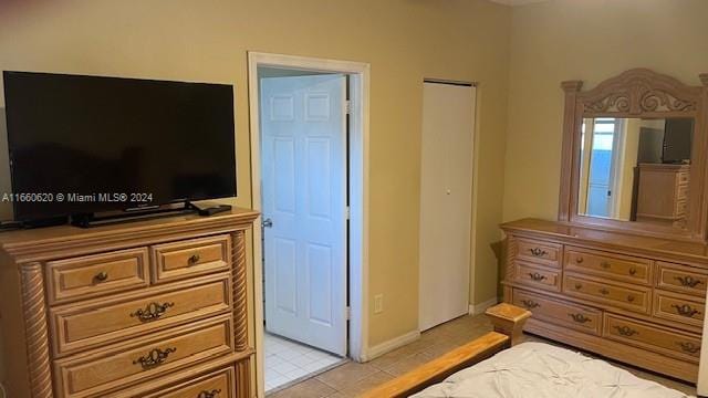 bedroom featuring light tile patterned floors