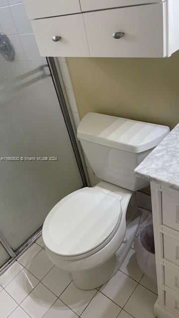 bathroom with vanity, walk in shower, and toilet