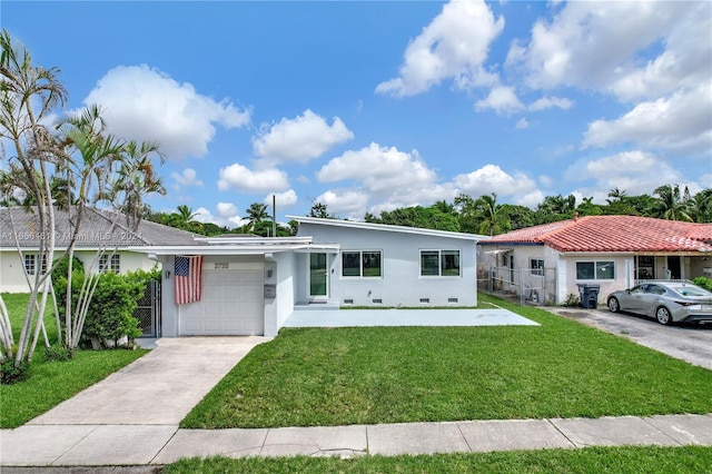 view of front of house featuring a garage and a front lawn