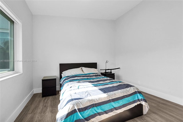 bedroom featuring dark hardwood / wood-style flooring