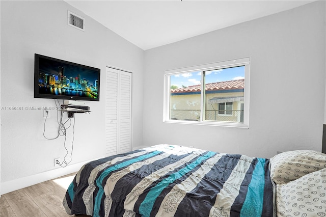 bedroom featuring a closet and hardwood / wood-style flooring