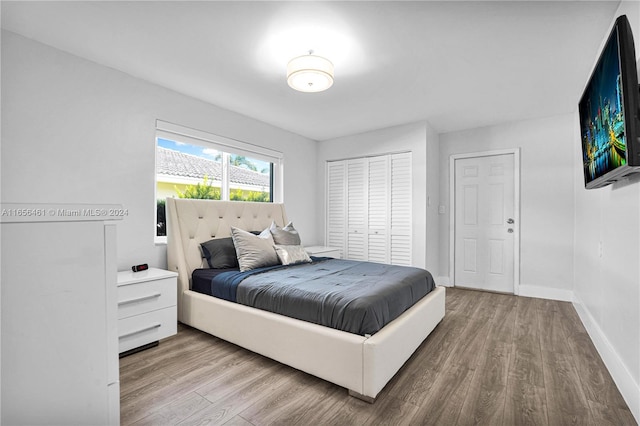 bedroom featuring light hardwood / wood-style flooring and a closet