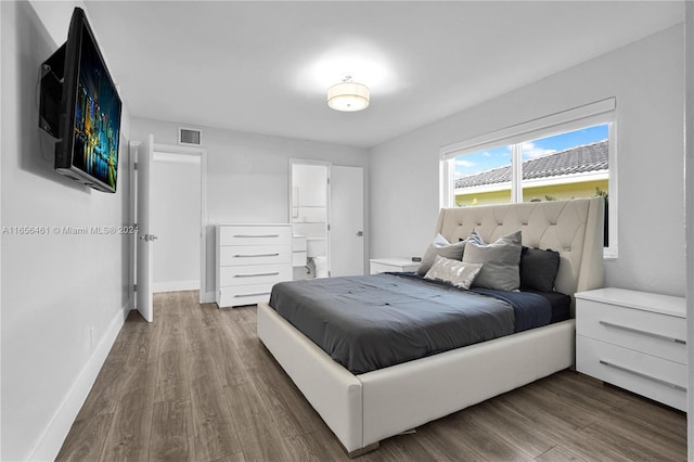 bedroom with hardwood / wood-style floors