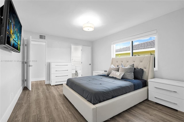 bedroom with hardwood / wood-style floors