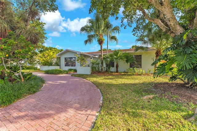 single story home featuring a front yard