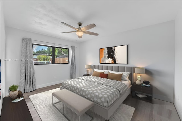 bedroom with hardwood / wood-style flooring and ceiling fan