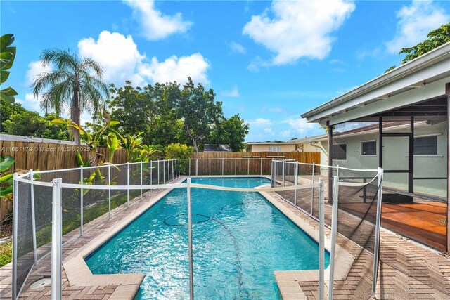 view of yard with a fenced in pool