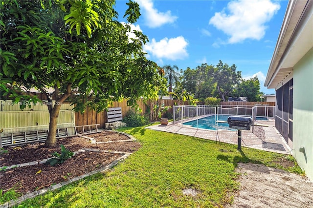 view of swimming pool featuring a lawn and a patio