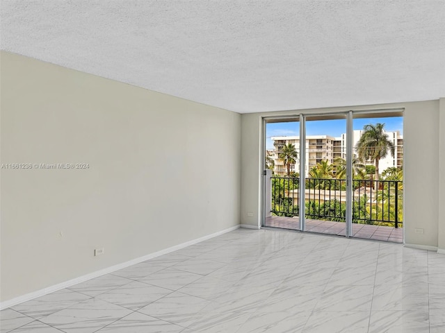 empty room with a textured ceiling