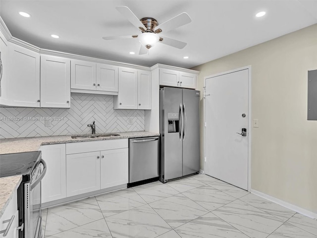 kitchen with ceiling fan, white cabinets, sink, tasteful backsplash, and appliances with stainless steel finishes