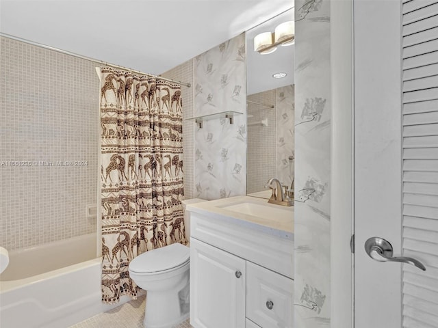 full bathroom featuring tile patterned floors, shower / bath combo, vanity, and toilet