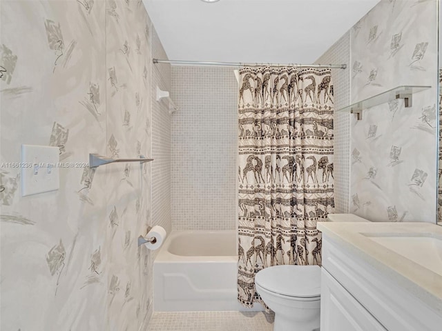 full bathroom with shower / bath combo with shower curtain, tile patterned flooring, vanity, and toilet