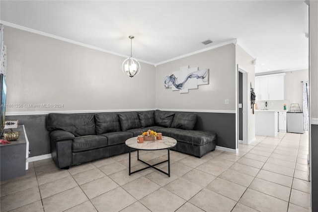 tiled living room featuring a chandelier and crown molding