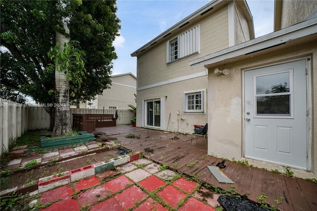 back of property featuring a wooden deck